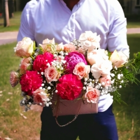 Florist choice arrangement in a small handbag